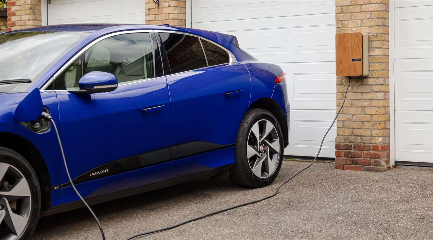 Level 2 EV charger mounted in a home garage