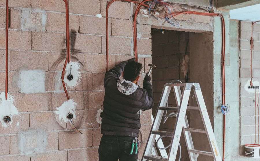 Electrician running wiring during a renovation