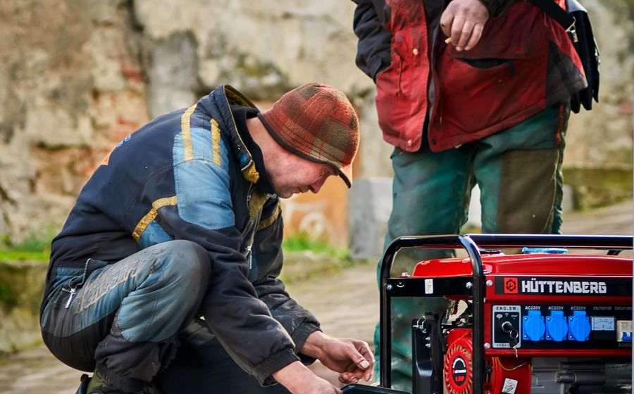 Technicians servicing a standby generator
